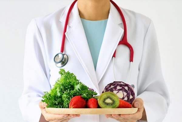 "Cheftitian" holding plate of veggies