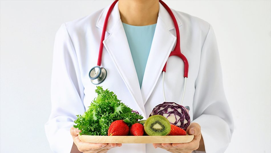 "Cheftitian" holding plate of veggies