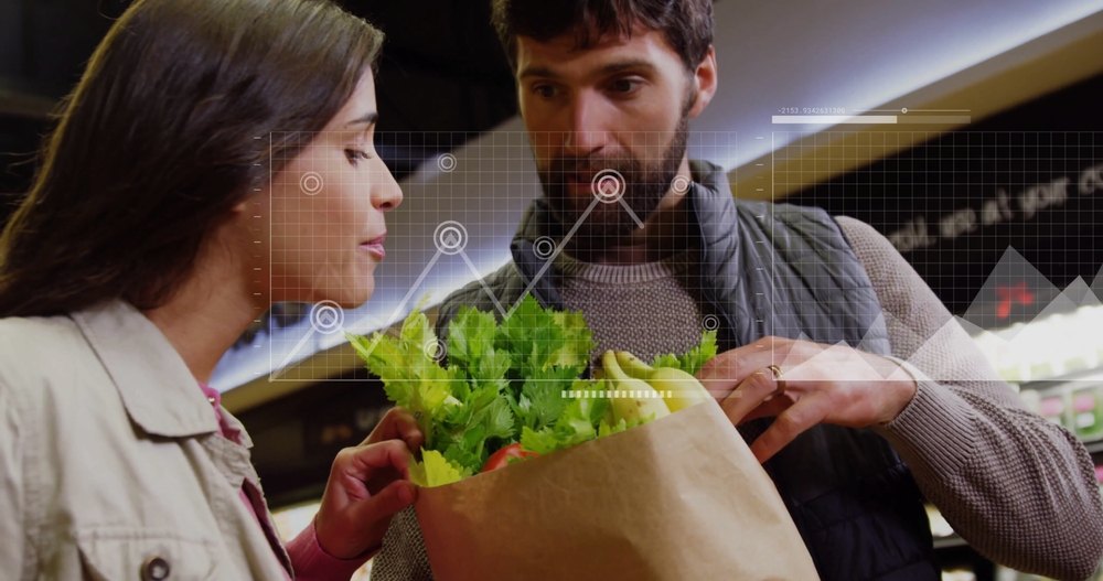 Grocery shopping data overlaid over a couple examining fresh produce in store.